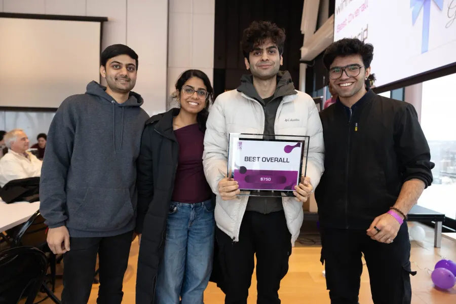The FoodGrid team at MLH CivicHacks holding the Best Overall award.